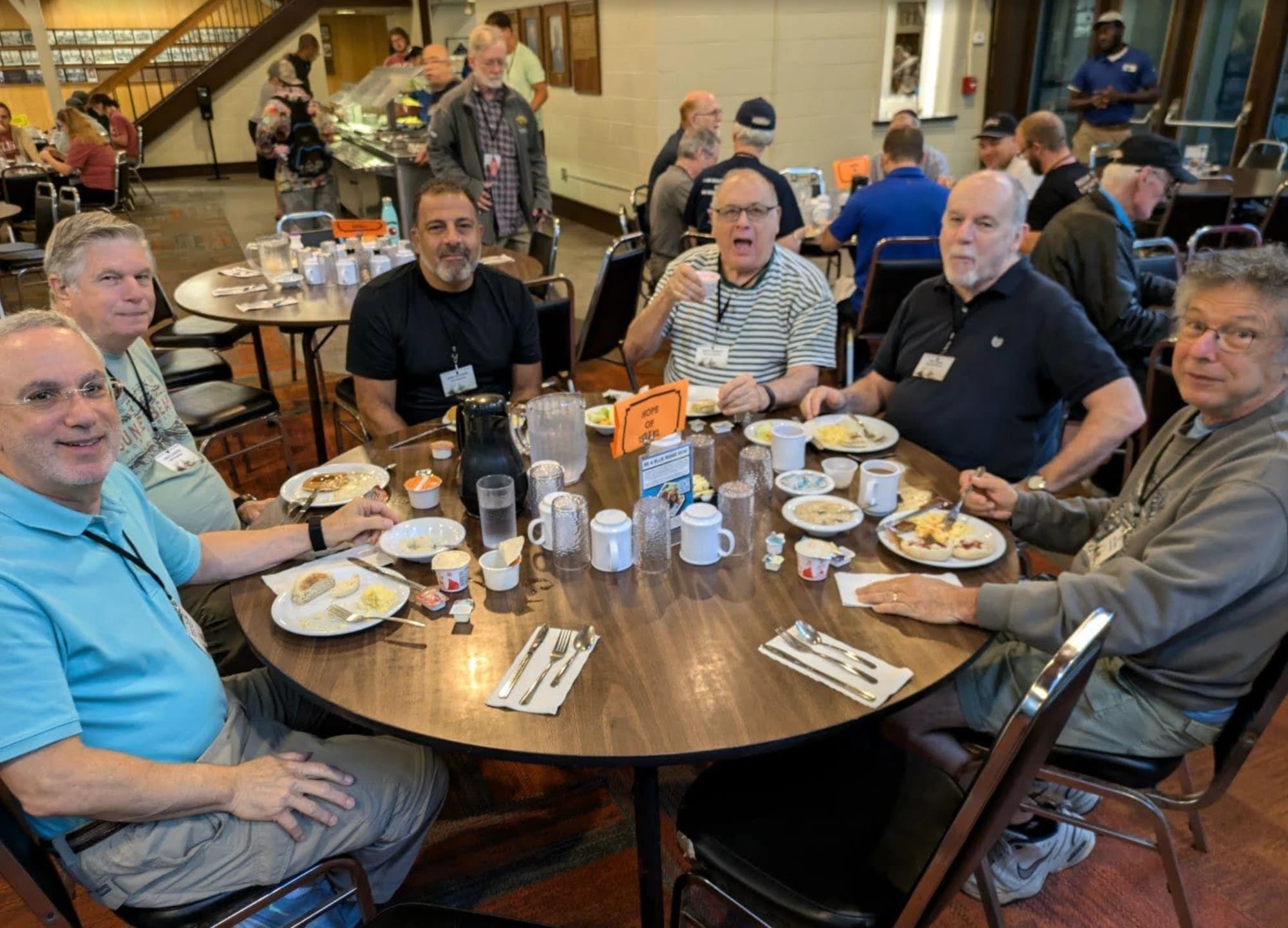 Men of Sha'arei Shalom around a breakfast table at the 2025 men's retreat